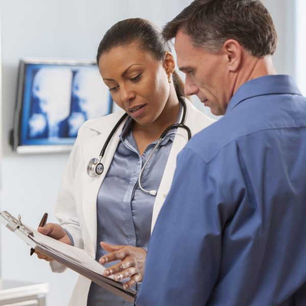 Female doctor talking with patient.